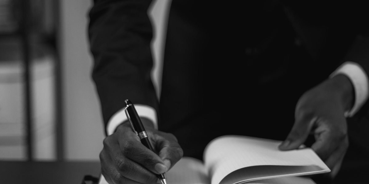 Close-up of sales conversation and note-taking